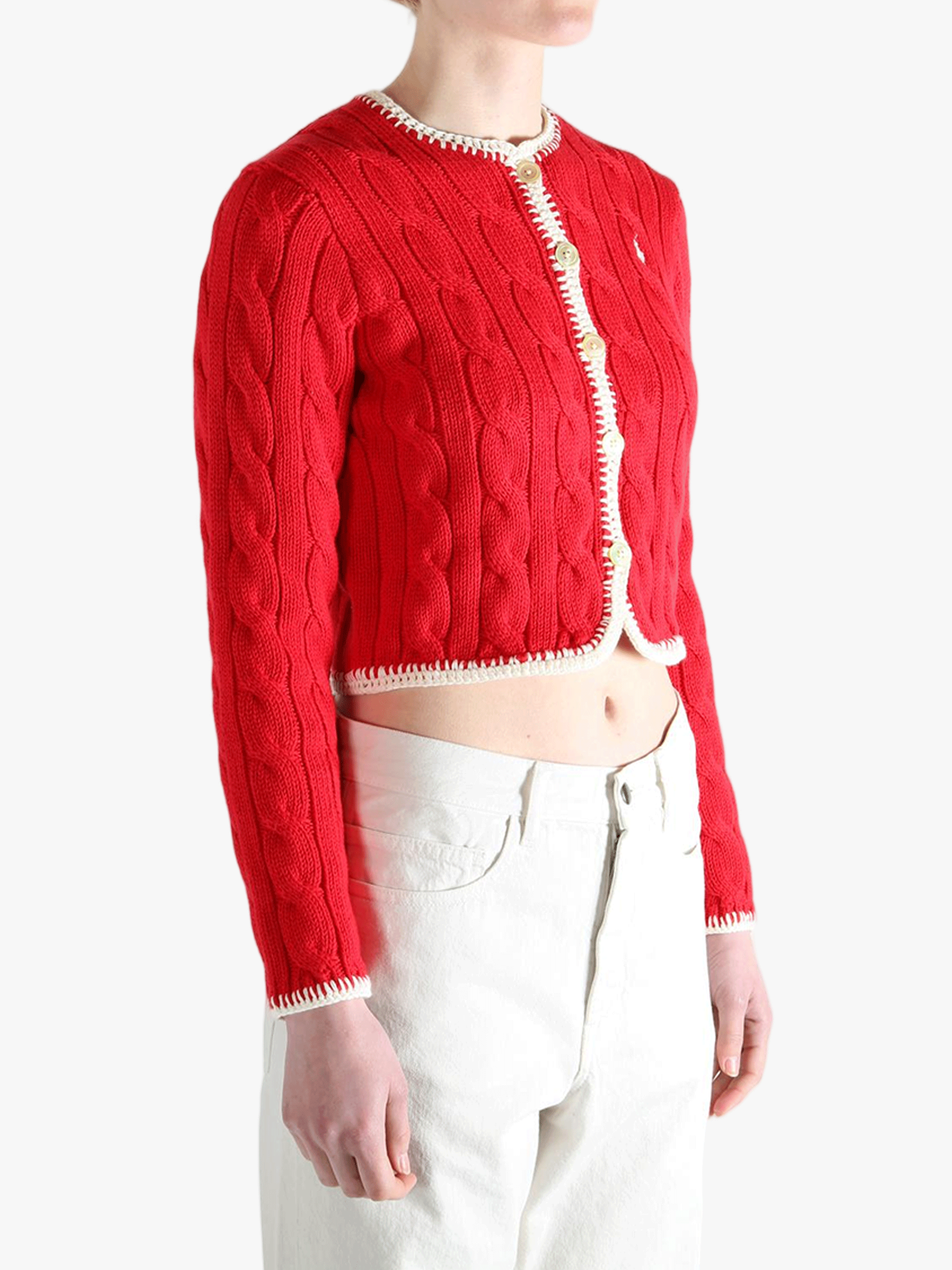 Red knitwear worn by a person, showing the knitwear fit