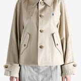 A tan jacket worn by a person, showing the jacket's fit