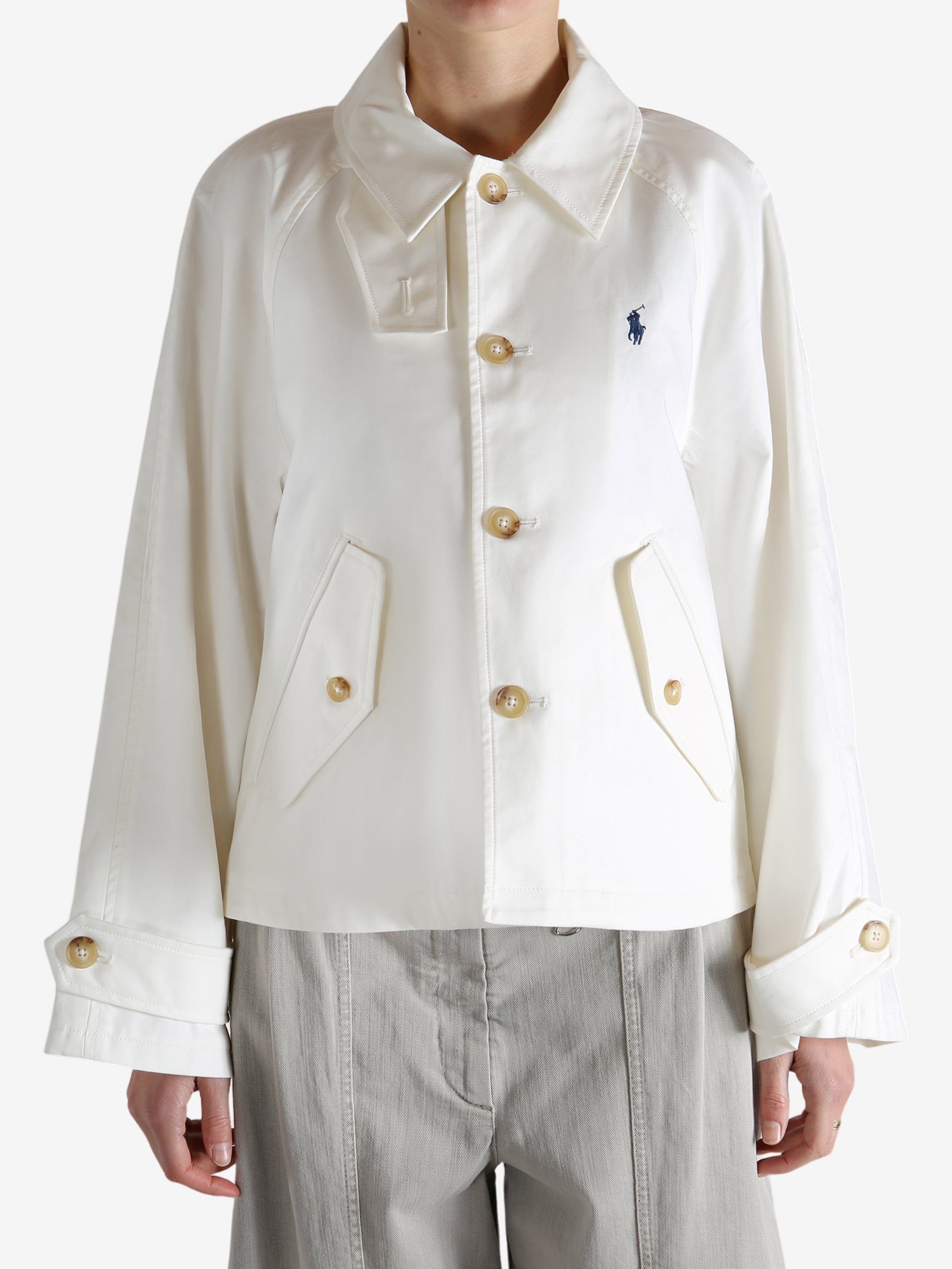 White jacket worn by a person, showing the jacket's fit
