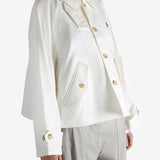 White jacket worn by a person, showing the jacket's fit