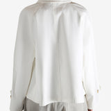 White jacket worn by a person, showing the jacket's fit