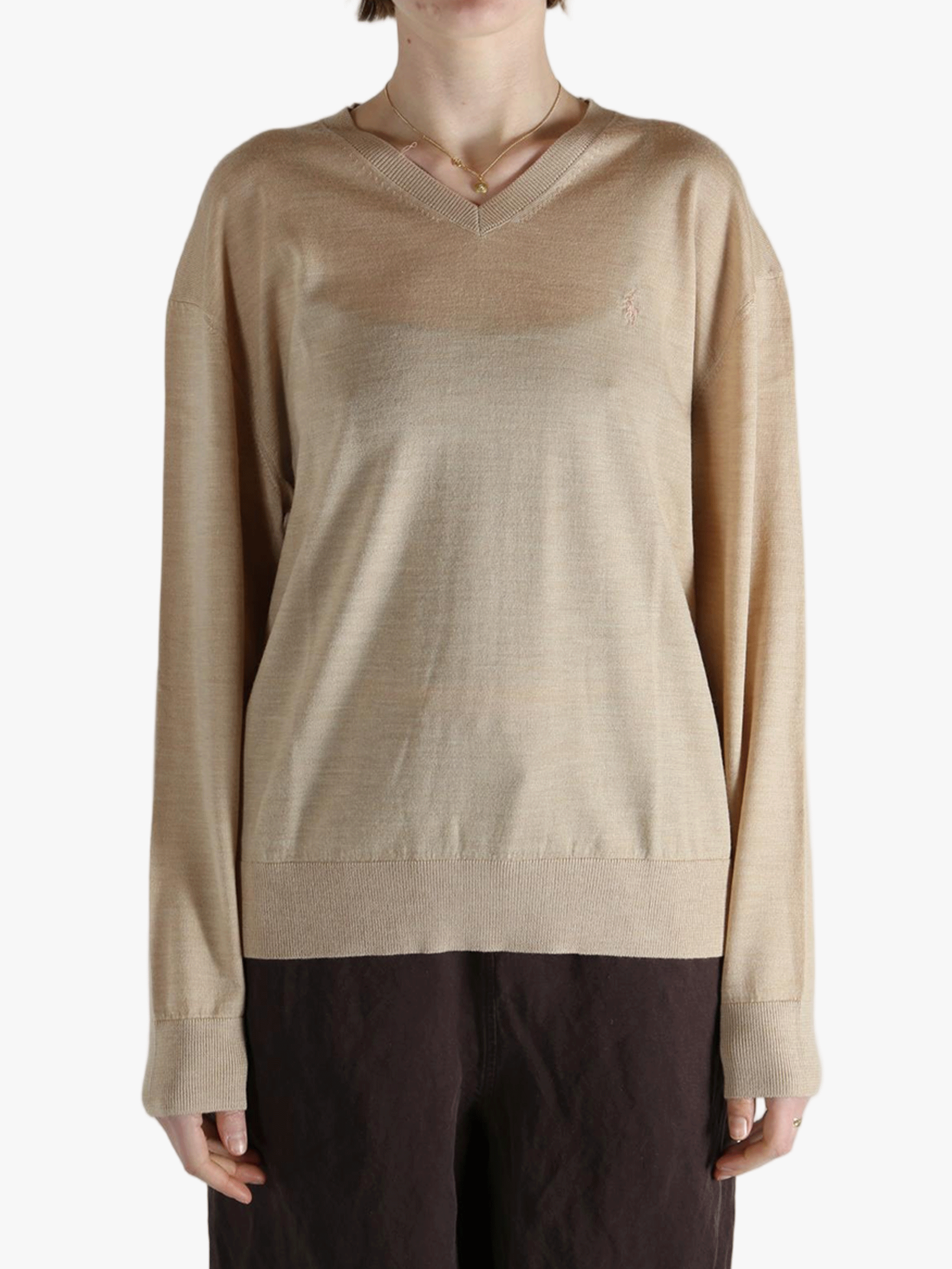 Tan sweater worn by a person, showing the sweater fit