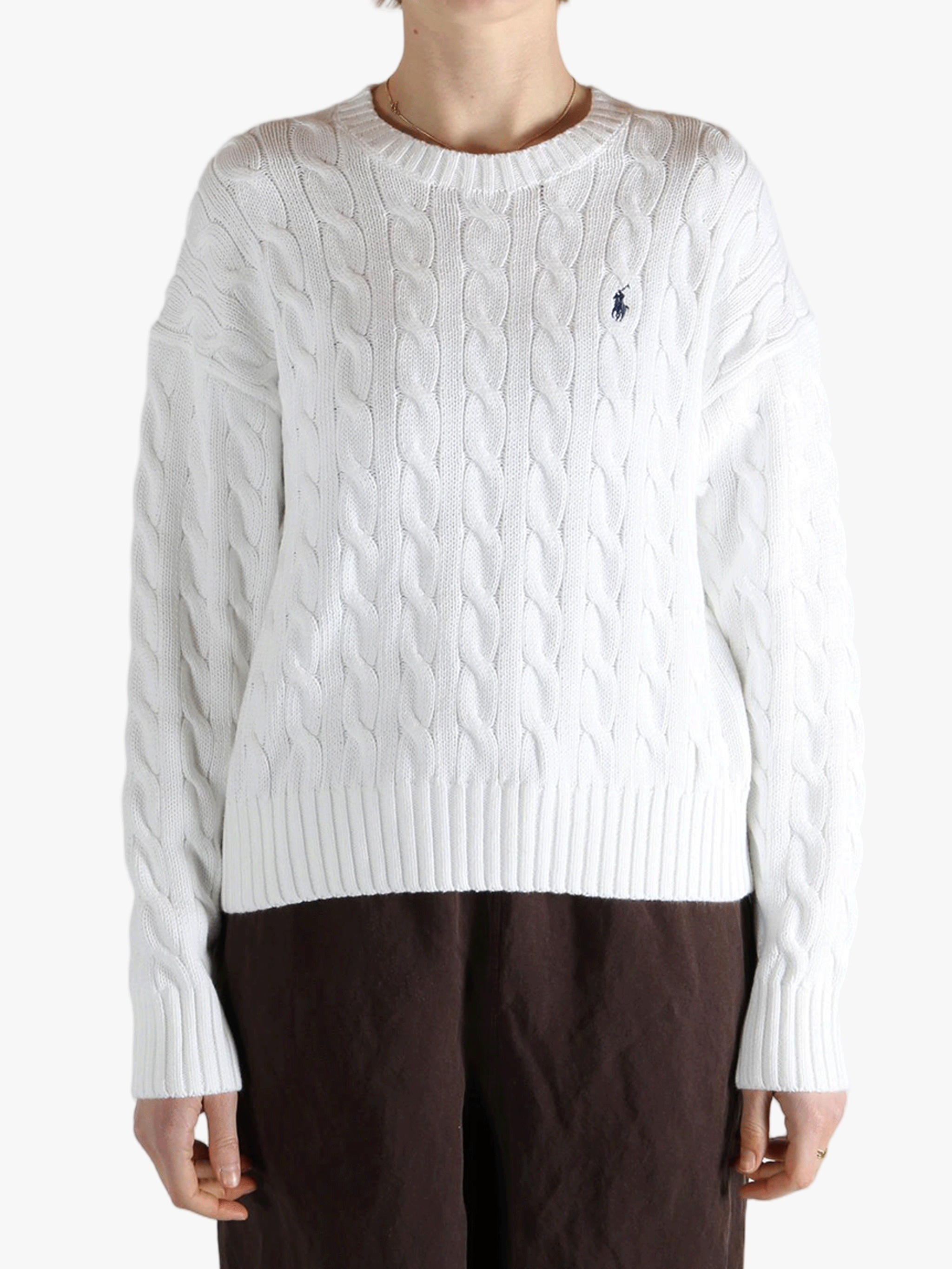 White sweater worn by a person, showing the sweater fit