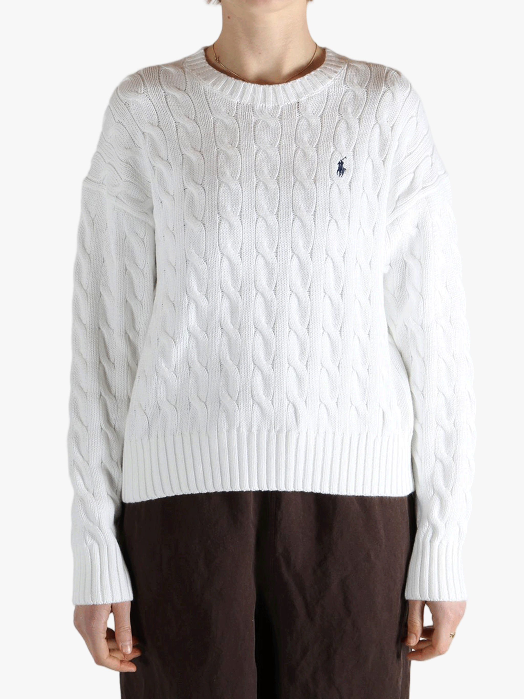 White sweater worn by a person, showing the sweater fit