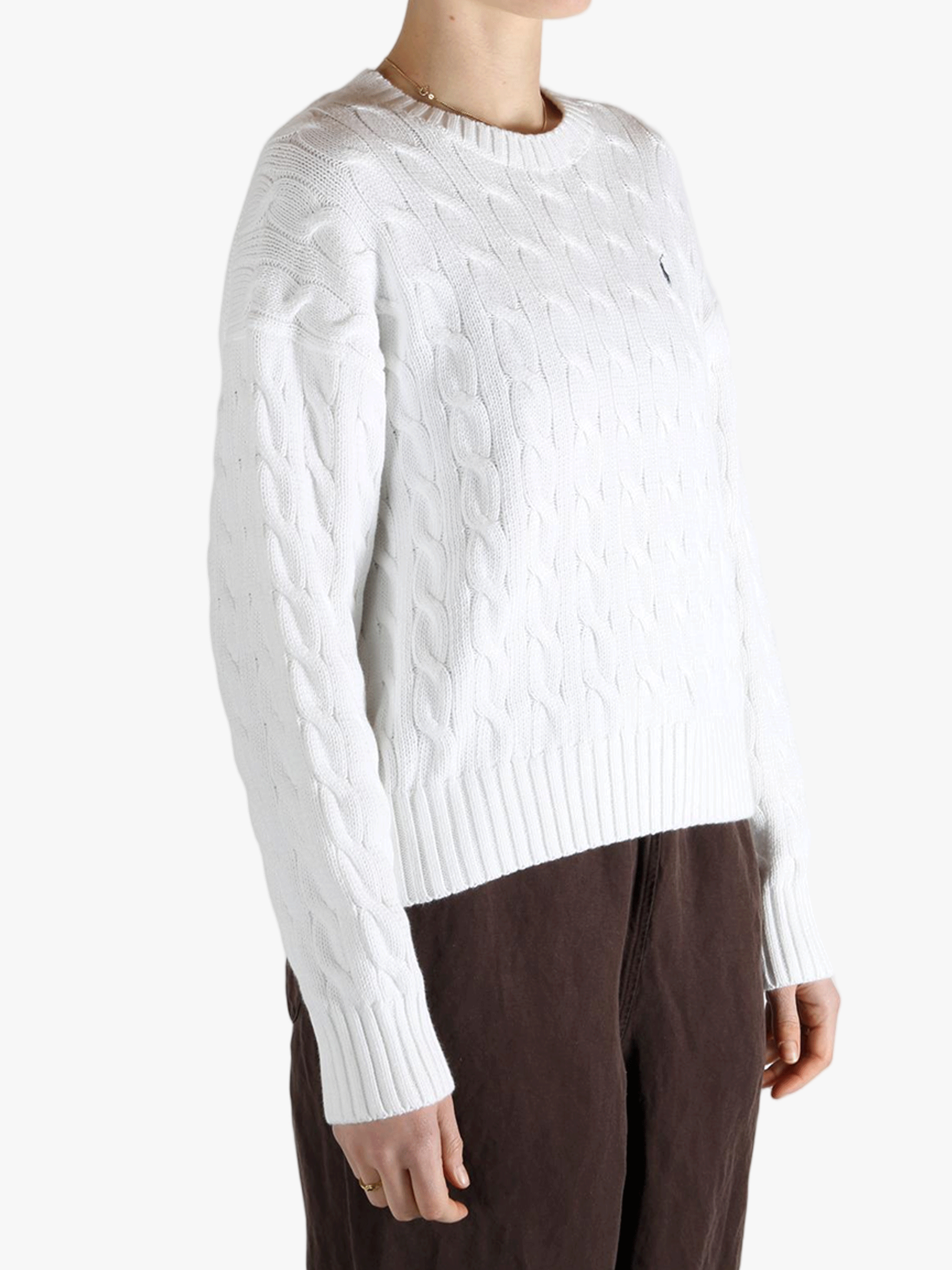 White sweater worn by a person, showing the sweater fit