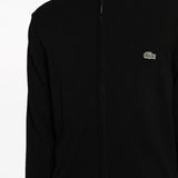 Close up of black sweater, showing texture of the cotton fabric