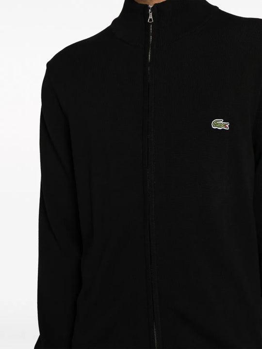 Close up of black sweater, showing texture of the cotton fabric