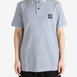 Grey top worn by a person, showing the top fit