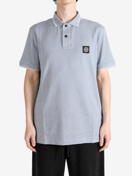 Grey top worn by a person, showing the top fit