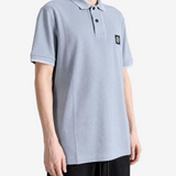 Grey top worn by a person, showing the top fit