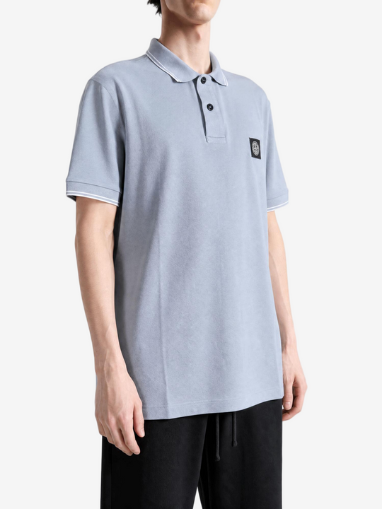 Grey top worn by a person, showing the top fit