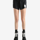 Black shorts worn by a person, showing the shorts fit