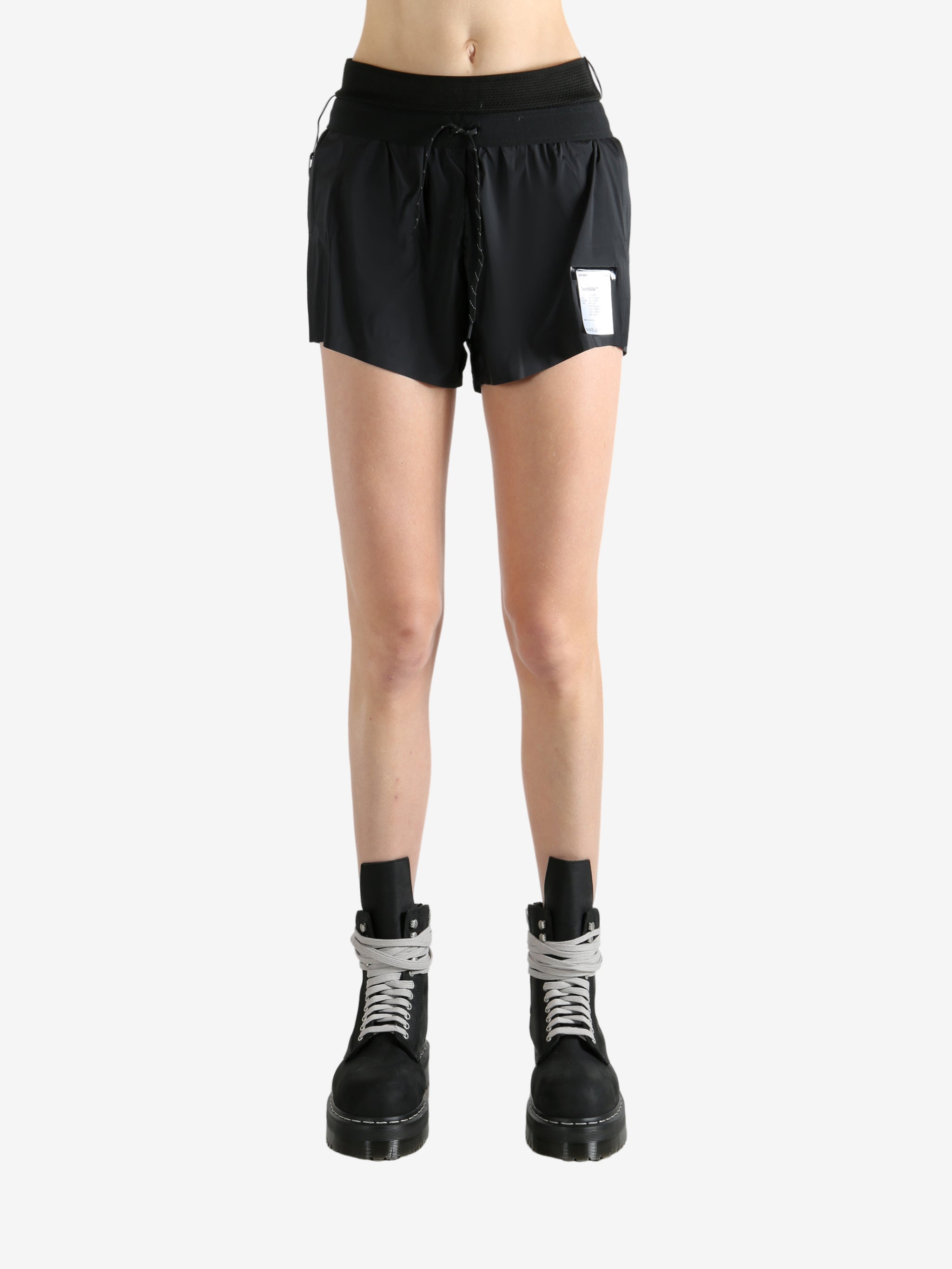 Black shorts worn by a person, showing the shorts fit