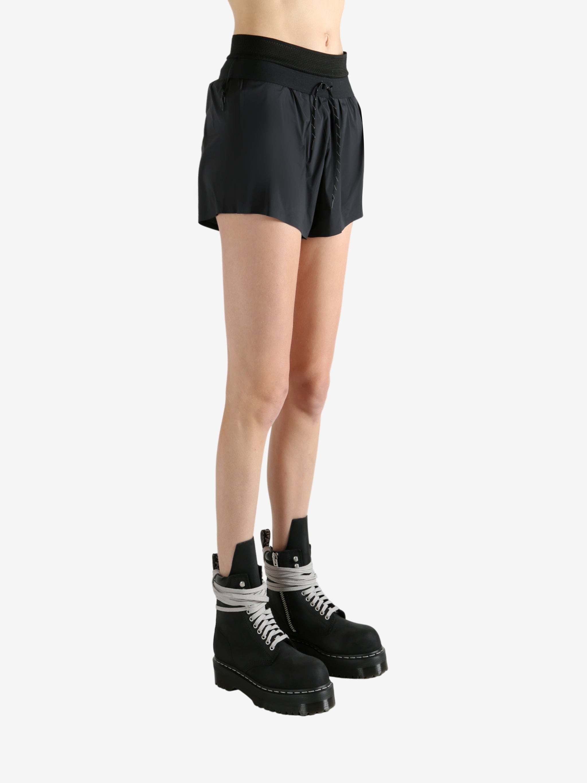 Black shorts worn by a person, showing the shorts fit