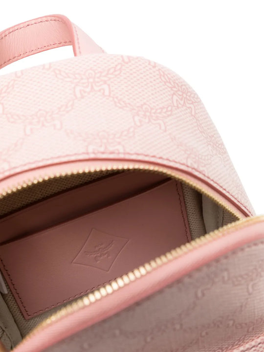 Close up of pink backpack, showing texture of the canvas fabric
