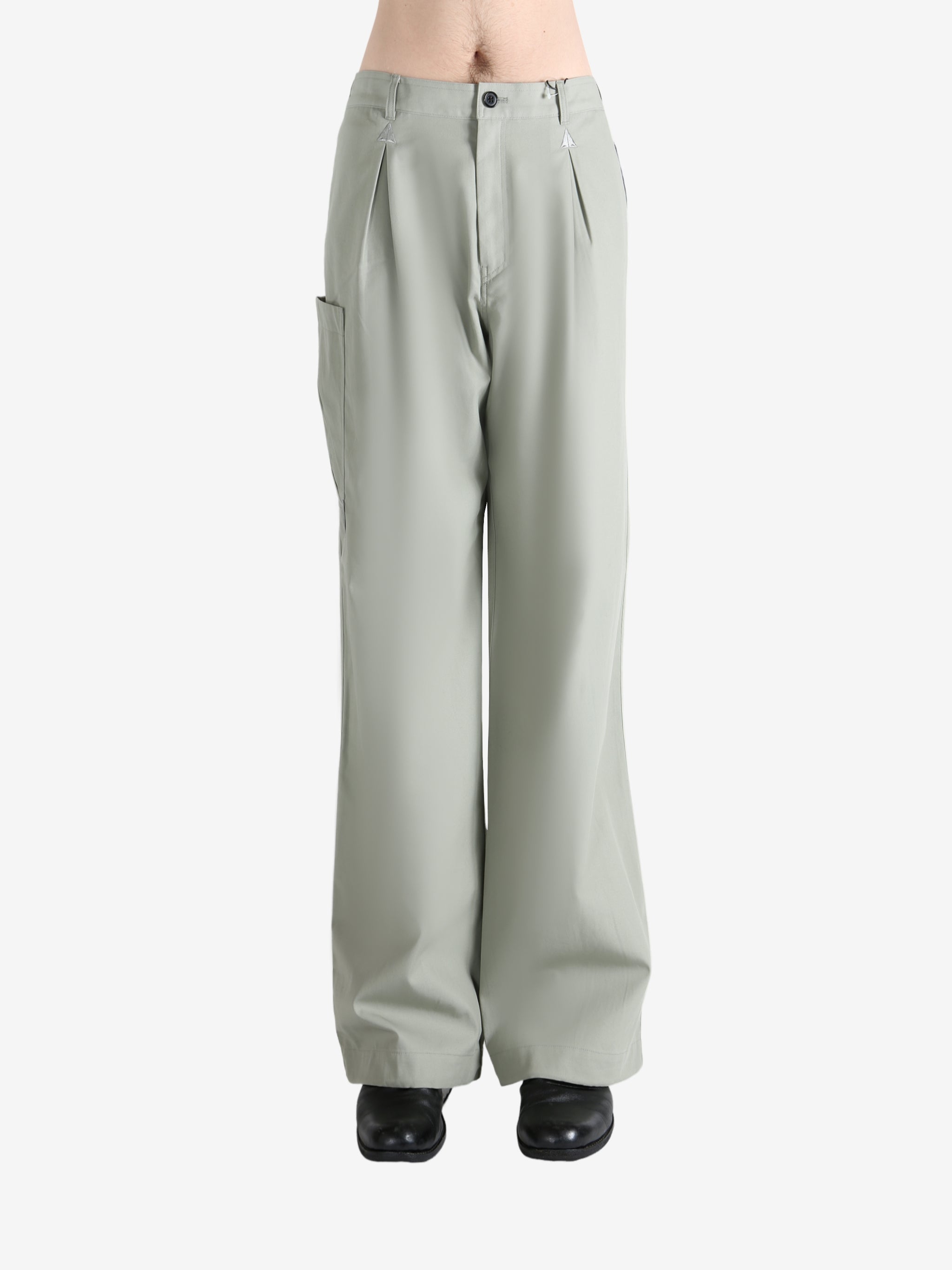 Grey pants worn by a person, showing the pants' fit