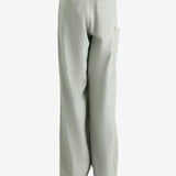 Grey pants worn by a person, showing the pants' fit