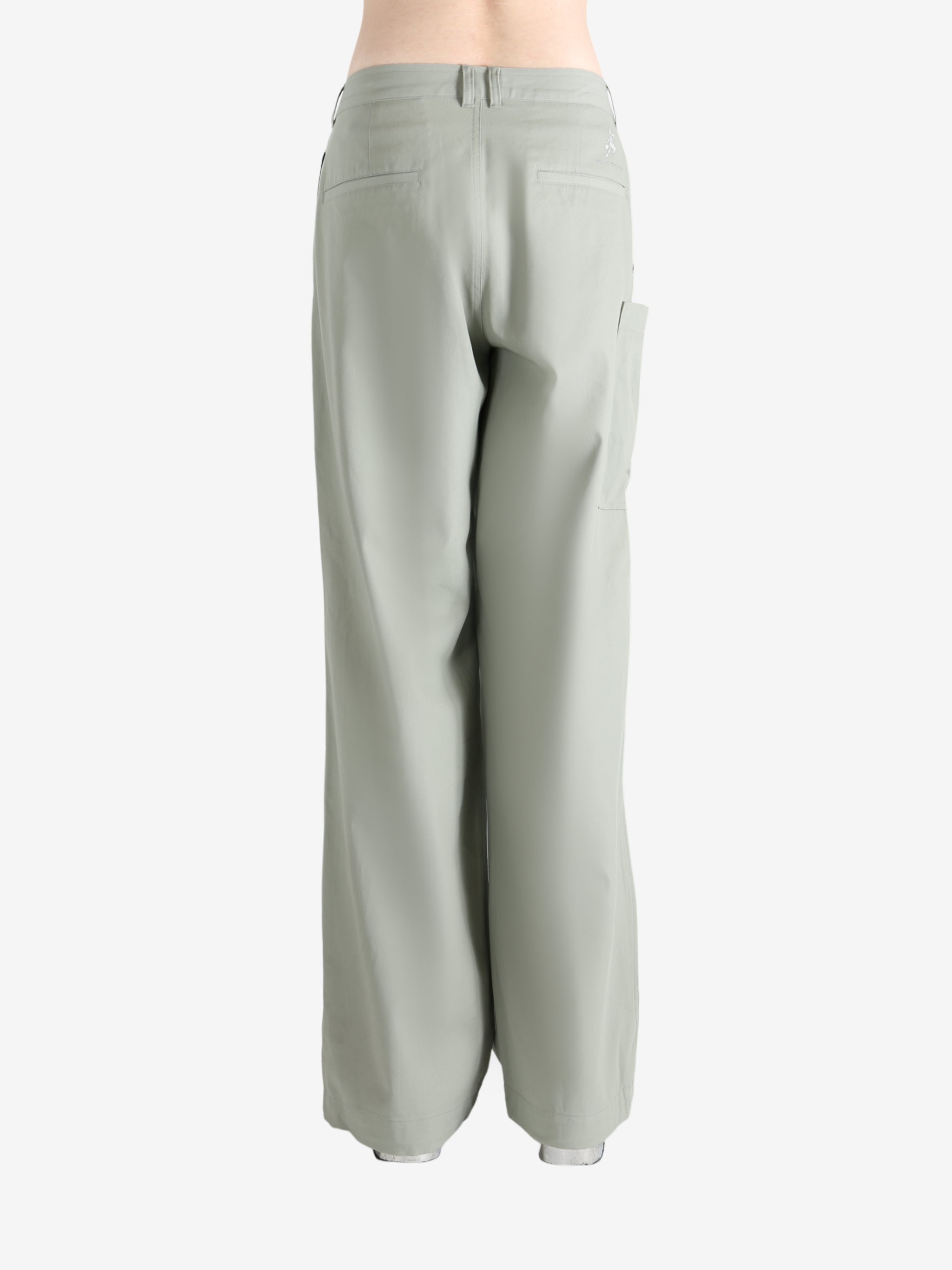 Grey pants worn by a person, showing the pants' fit