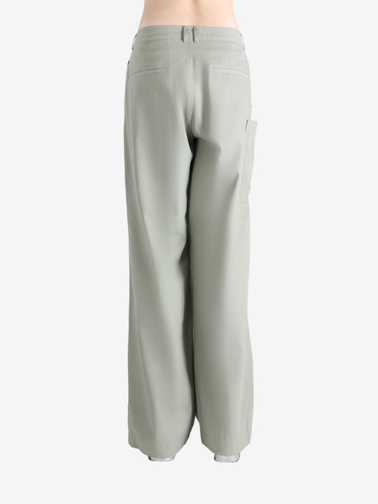 Grey pants worn by a person, showing the pants' fit