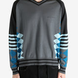 Grey jumper worn by a person, showing the jumper's fit