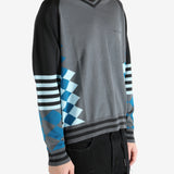 Grey jumper worn by a person, showing the jumper's fit