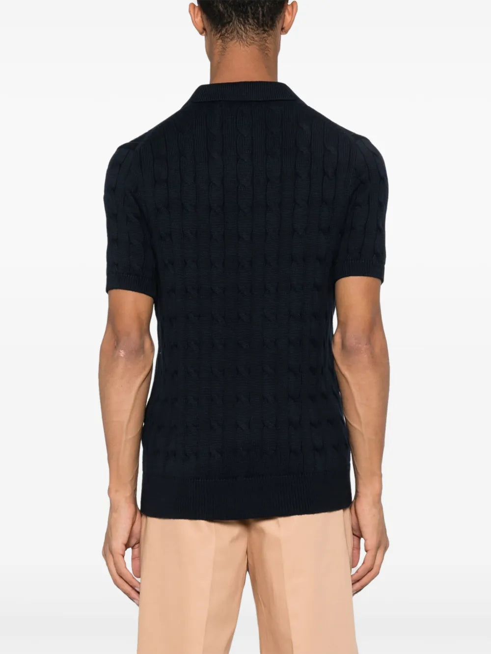 Navy knitwear worn by a person, showing the knitwear fit