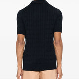 Navy knitwear worn by a person, showing the knitwear fit