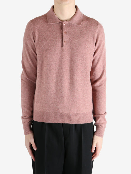 Pink sweater worn by a person, showing the sweater's fit