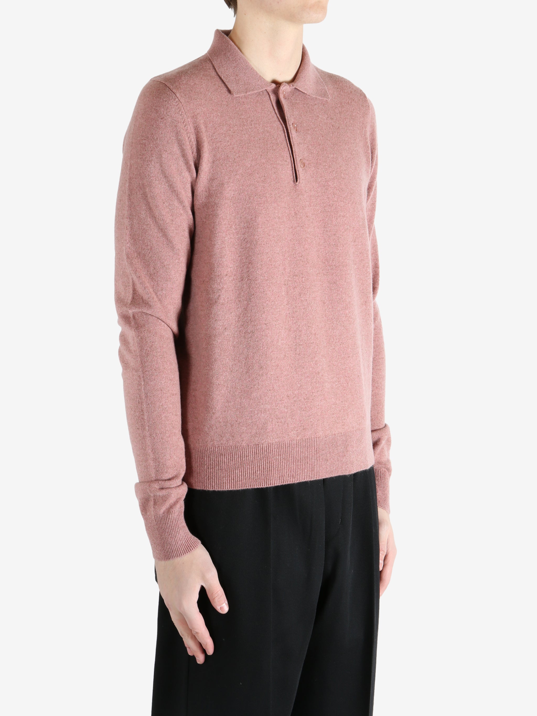 Pink sweater worn by a person, showing the sweater's fit