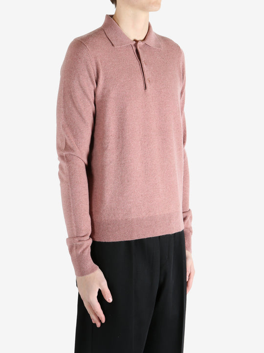 Pink sweater worn by a person, showing the sweater's fit