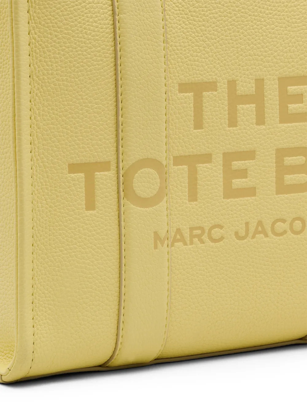 close up of yellow bags, showing texture of the leather fabric