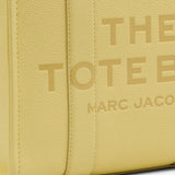 close up of yellow bags, showing texture of the leather fabric