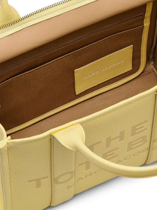 close up of yellow bags, showing texture of the leather fabric