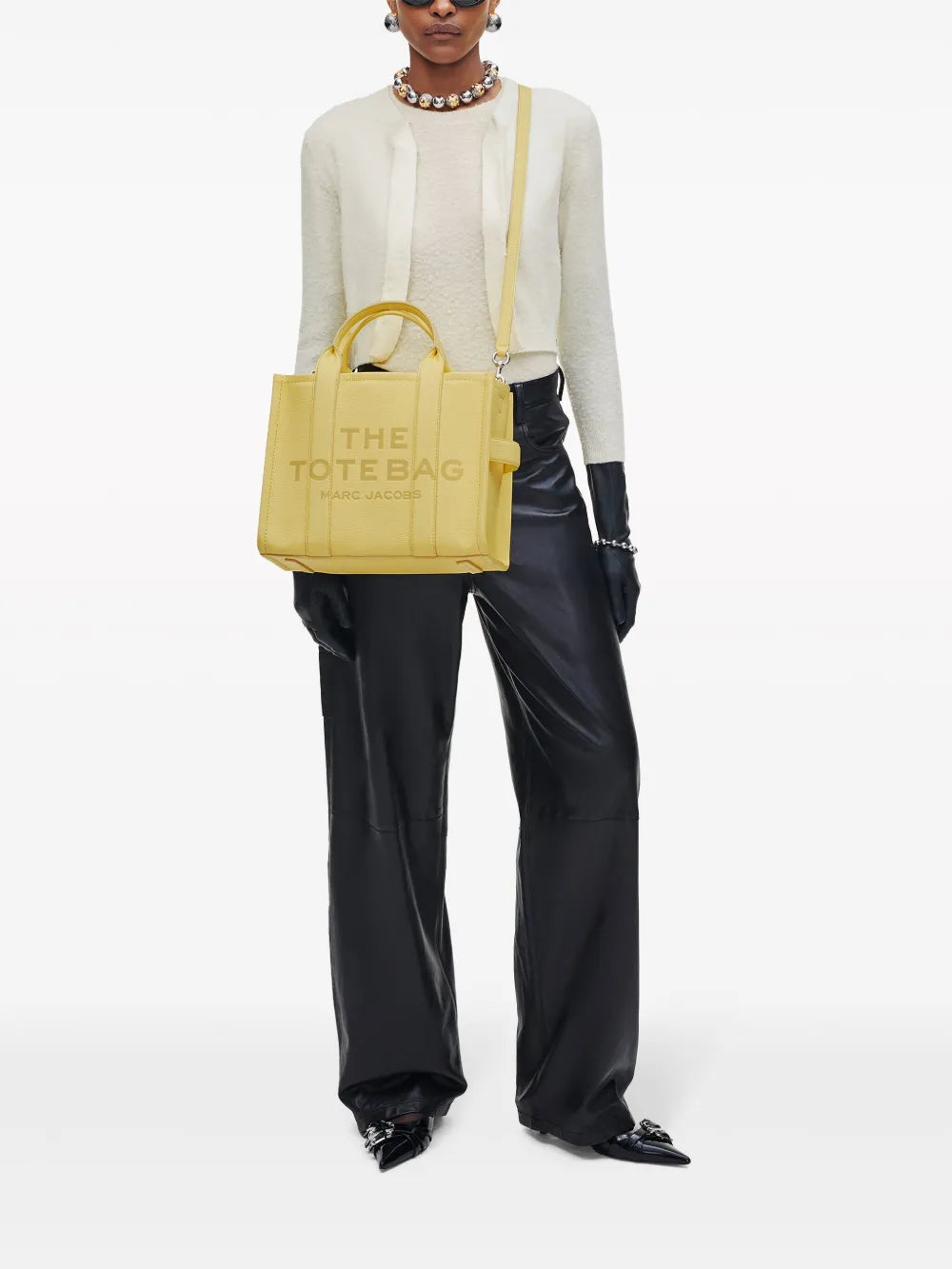 yellow bags worn by a person, showing the bags fit