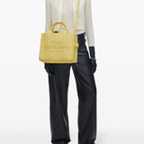 yellow bags worn by a person, showing the bags fit