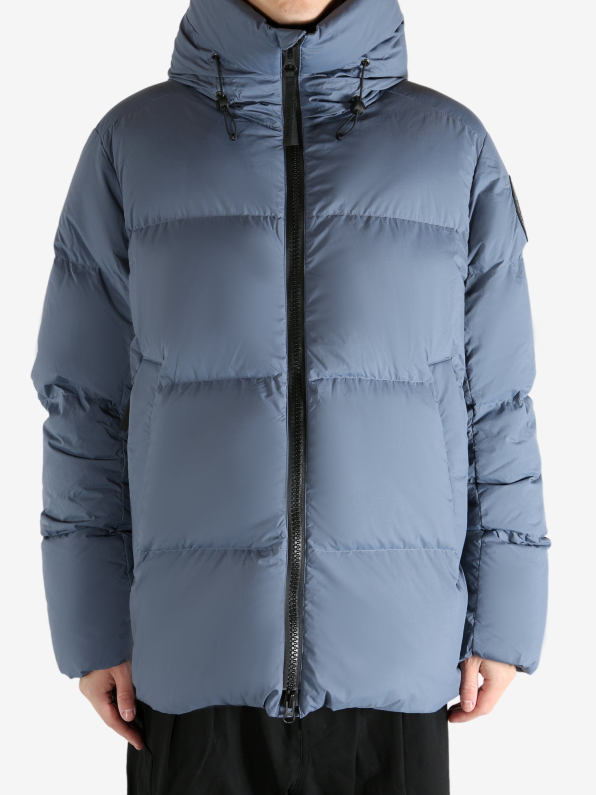 Blue jacket worn by a person, showing the jacket's fit