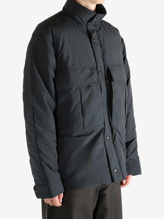 Black jacket worn by a person, showing the jacket's fit