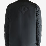 Black jacket worn by a person, showing the jacket's fit