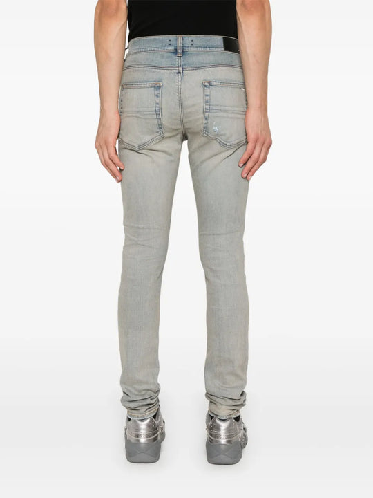 Blue pants worn by a person, showing the pants fit