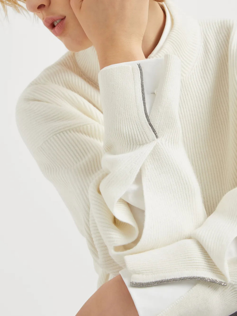 Close up of white knitwears, showing texture of the cashmere fabric