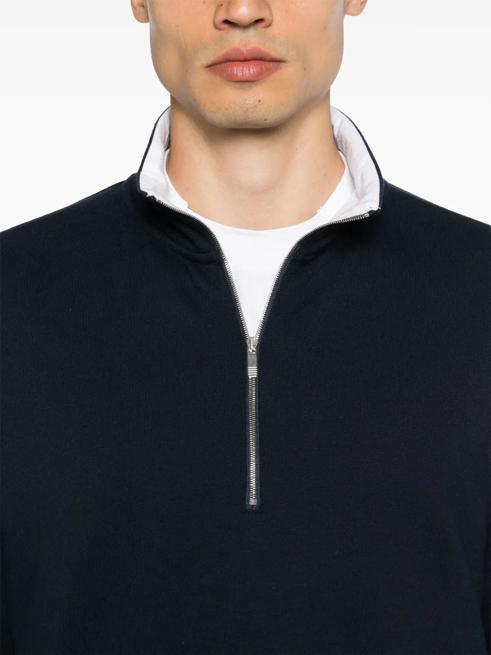 Close up of navy pullover,showing texture of the cotton fabric.