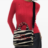 Black bag worn by a person, showing the bag's fit