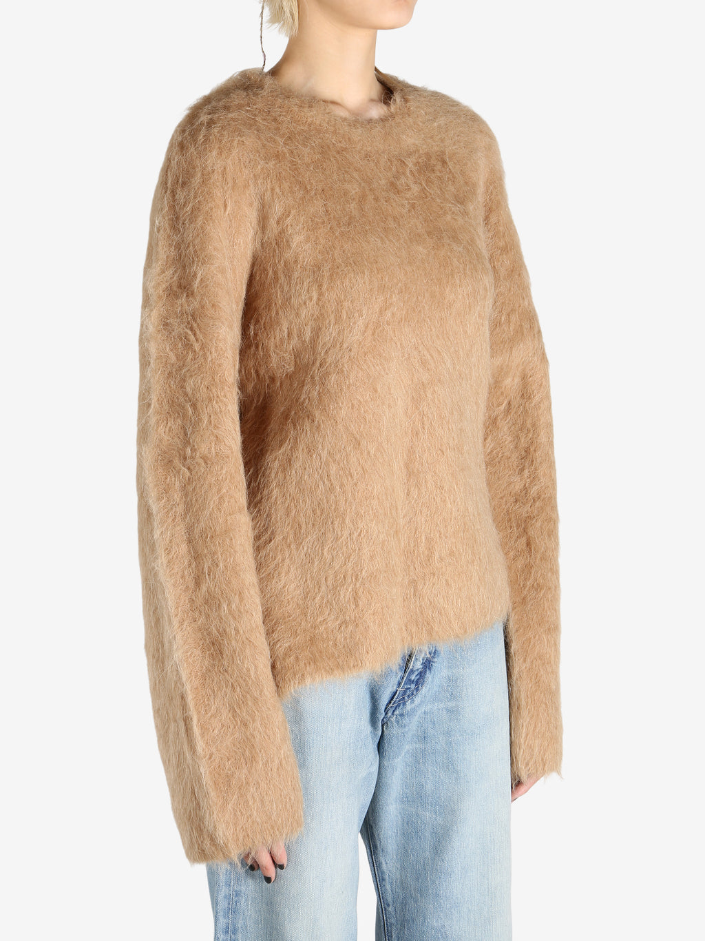 Brown knitwear worn by a person, showing the knitwear fit