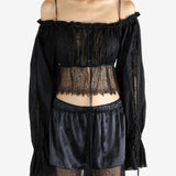 Black top worn by a person, showing the top's fit