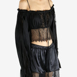 Black top worn by a person, showing the top's fit