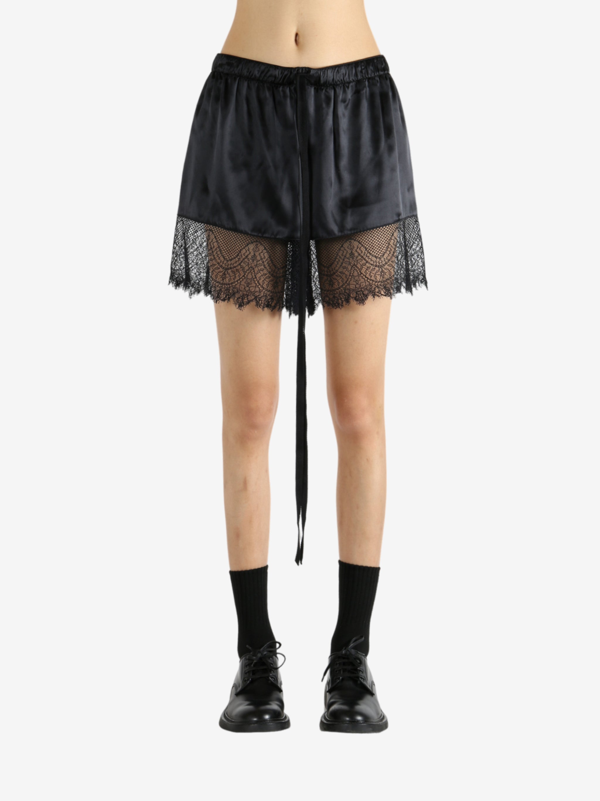 Black shorts worn by a person, showing the shorts' fit