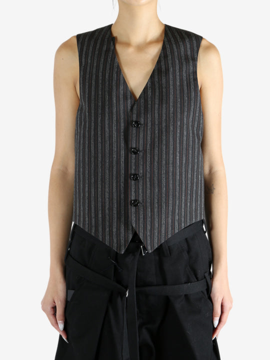 Black jacket worn by a person, showing the jacket's fit