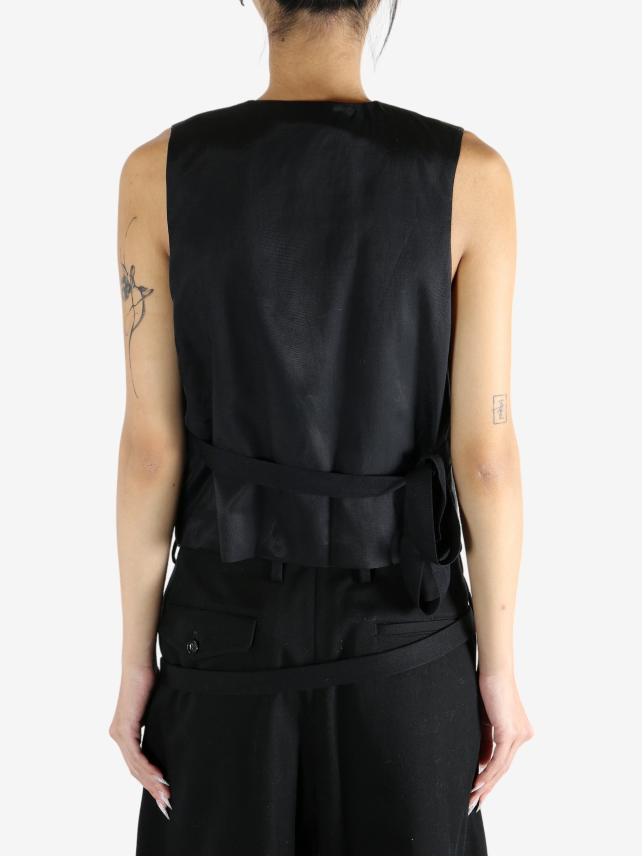 Black jacket worn by a person, showing the jacket's fit