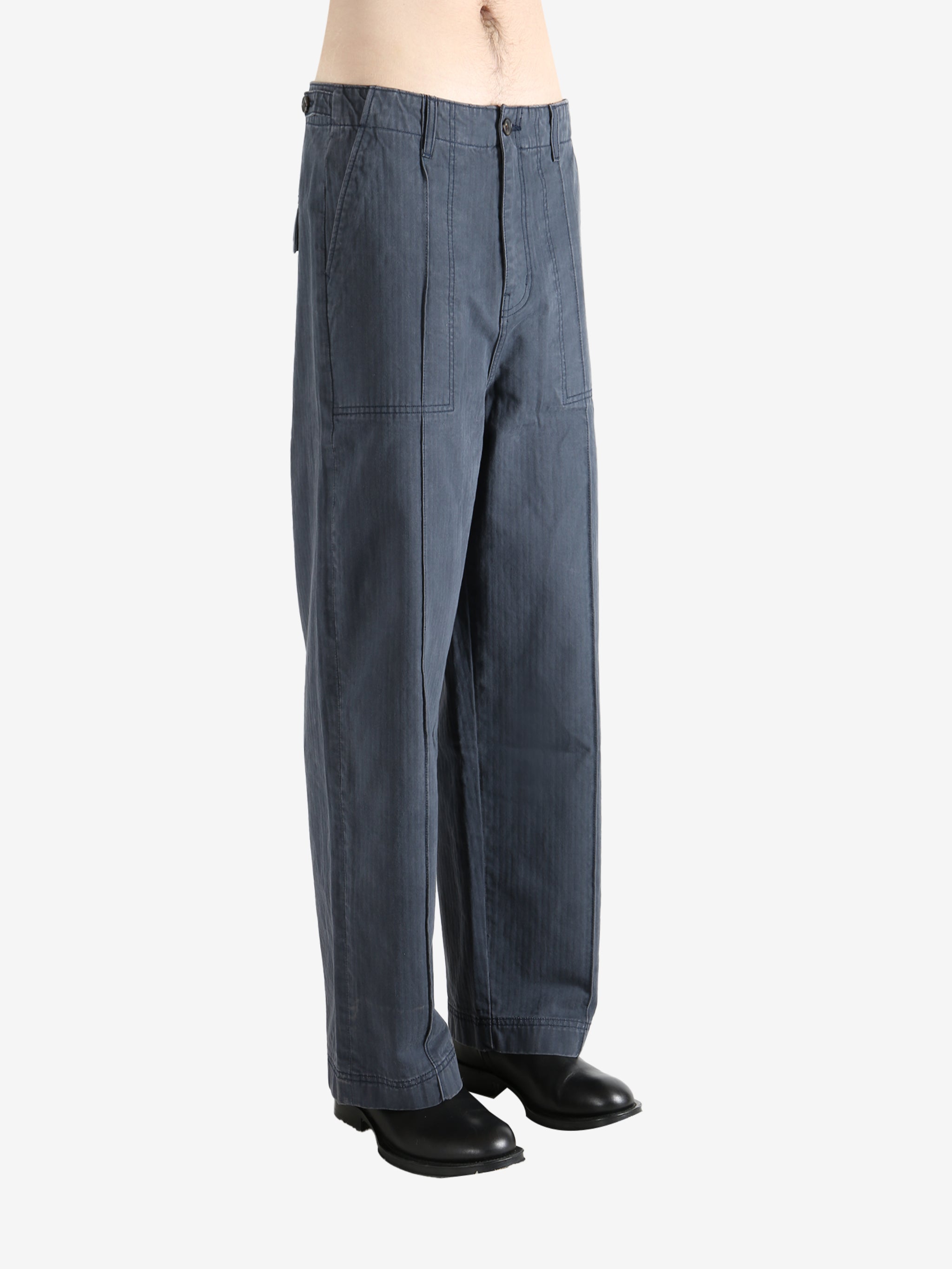 Grey pants worn by a person, showing the pants' fit