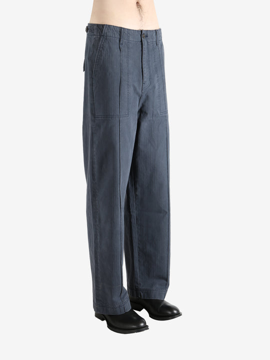 Grey pants worn by a person, showing the pants' fit